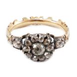 A late 18th century gold and old cut diamond set circular cluster ring, with carved shank and