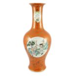 A Chinese coral ground vase, Qianlong mark but early 20th century, painted to three circular