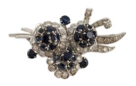 A white gold, sapphire and diamond cluster set floral spray brooch, 53mm, gross weight 18.8