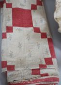 A mid to late 19th century hand stitched patch worked quilt,210 cms x 200 cms,