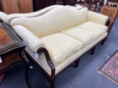 A pair of early 20th century Chippendale revival mahogany three seater settees upholstered in a