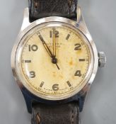 A gentleman's mid 20th century stainless steel Tudor Oyster manual wind wrist watch, with baton