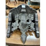 A Victorian carved oak dog's head wall bracket, width 48cm, height 35cm