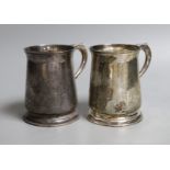 A pair 1970's silver mugs with S-scroll handles, by Asprey & Co Ltd, London, 1973, height 10.8cm,