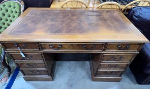 A good quality reproduction Victorian style oak pedestal desk, length 137cm, depth 76cm, height