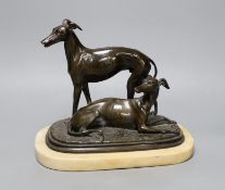 A 19th century patinated spelter greyhound group, unsigned, on alabaster plinth,20cm high,