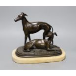 A 19th century patinated spelter greyhound group, unsigned, on alabaster plinth,20cm high,