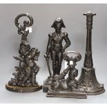 A cherubic cast iron door stop, another of Napoleon, a sphinx and another,(4)Napoleon 40 cms high,