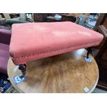 A Victorian rectangular stool on turned mahogany legs with spoked castors, length 93cm, width