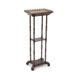 An early Victorian rosewood etagere, the rectangular top with pierced ormolu gallery, on turned