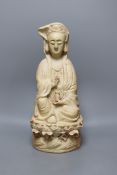 A Chinese biscuit figure of Guanyin,38 cms high,