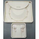 A boxed modern 14k and cultured pearl set necklace, 40cm and a pair of matching earrings.