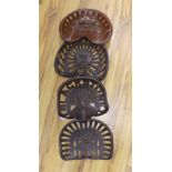 Four assorted cast iron and enamelled tractor seats,