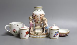 A Meissen cherub centrepiece a similar cup and box base, together with two Meissen style jars and