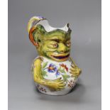 A Rouen faience grotesque jug,19.5 high,