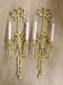 A pair of Louis XVI style carved giltwood wall lights, with ribbon crests and flowers in basket