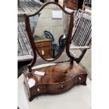 A George III serpentine mahogany box base toilet mirror, width 43cm, depth 21cm, height 57cm