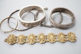 A Chinese white metal hinged bangle and five other items, including an engraved silver hinged