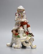 A Bow figure of Winter on a scroll moulded base painted with flowers, having an anchor dagger mark