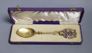 A cased Edward VIII Coronation silver gilt and enamel spoon, the bowl embossed with the bust of