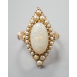 A yellow meat, white opal and seed pearl set marquise shaped cluster ring, size J/K, gross weight