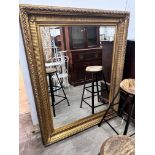 A large Victorian style rectangular gilt wall mirror, width 123cm, height 154cm