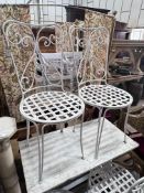 A set of four painted wrought iron garden chairs, height 96cm