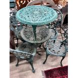 A Victorian style painted aluminium circular garden table, four chairs and a low garden table,