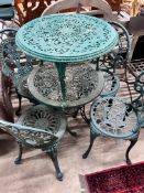 A Victorian style painted aluminium circular garden table, four chairs and a low garden table,