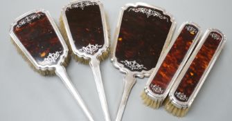 A George V silver and tortoiseshell mounted five piece mirror and brush set by Mappin & Webb,