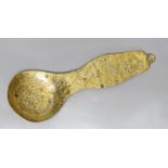 A folk art cast brass ladle,27cms long,