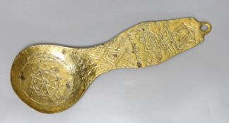 A folk art cast brass ladle,27cms long,