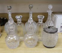 A pair of hobnail cut decanters two other pairs of cut glass decanters a single decanter and a glass