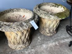 A pair of circular reconstituted stone basket weave effect garden planters, diameter 38cm, height