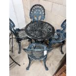 A Victorian style aluminium circular garden table, diameter 60cm, height 62cm and four chairs