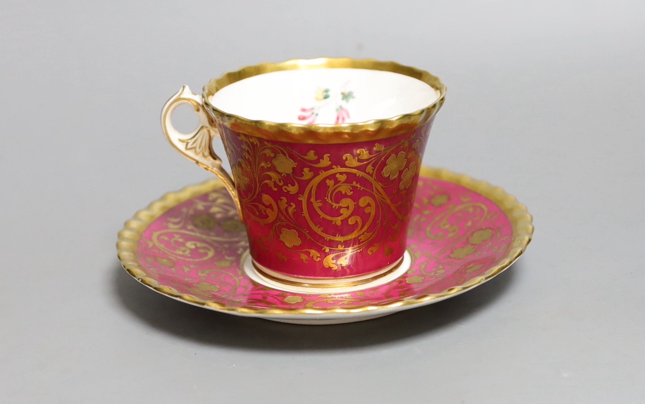 A Chamberlains Worcester superb coffee cup and saucer with crinson ground and elaborate gilding