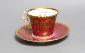 A Chamberlains Worcester superb coffee cup and saucer with crinson ground and elaborate gilding