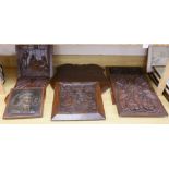 Six mixed oak carved panels and a metal relief mounted panel,