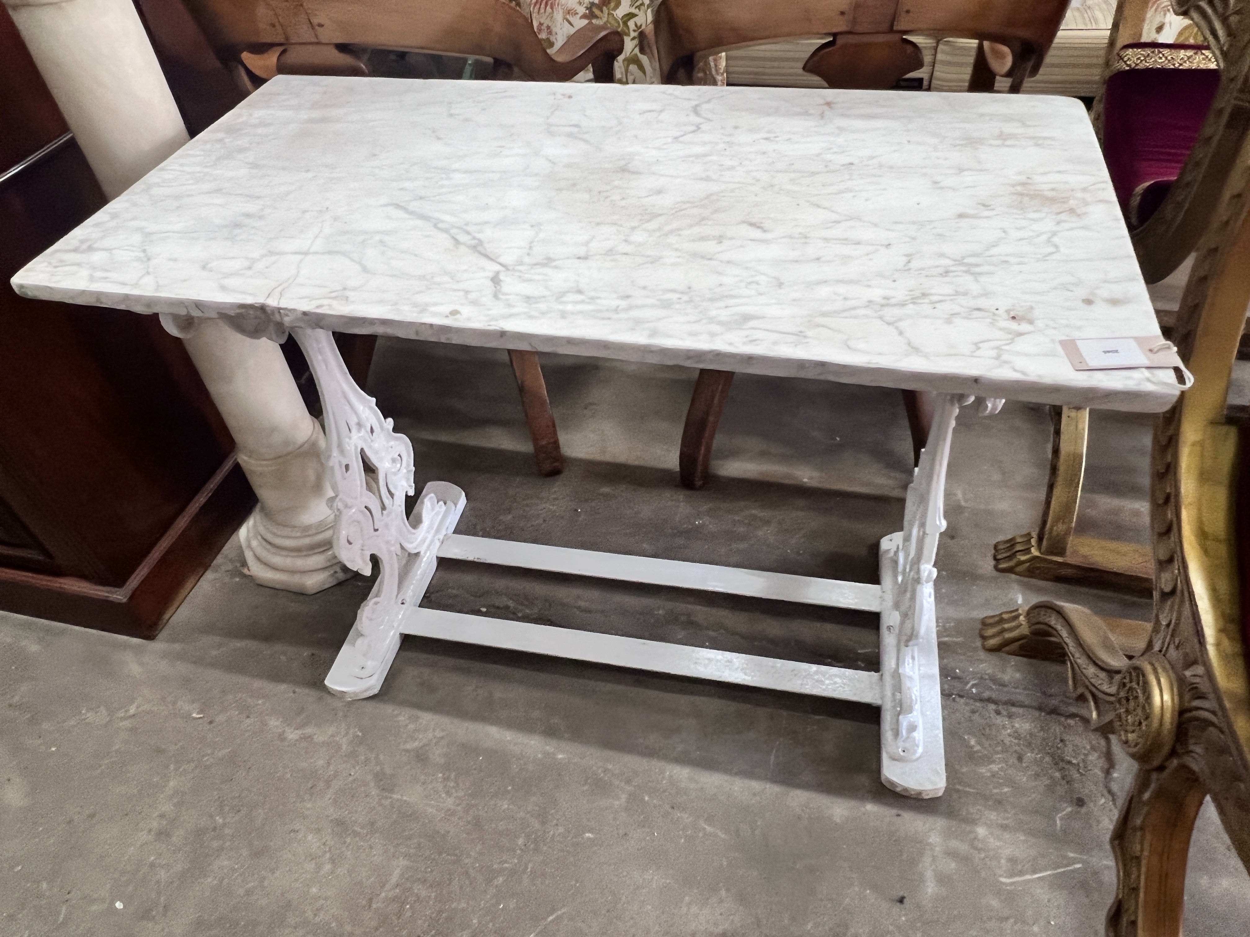 A Victorian painted cast iron garden table with rectangular marble top, length 97cm, depth 50cm,