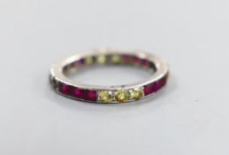 A white metal and gem set eternity ring, size L/M, gross weight 2.6 grams.