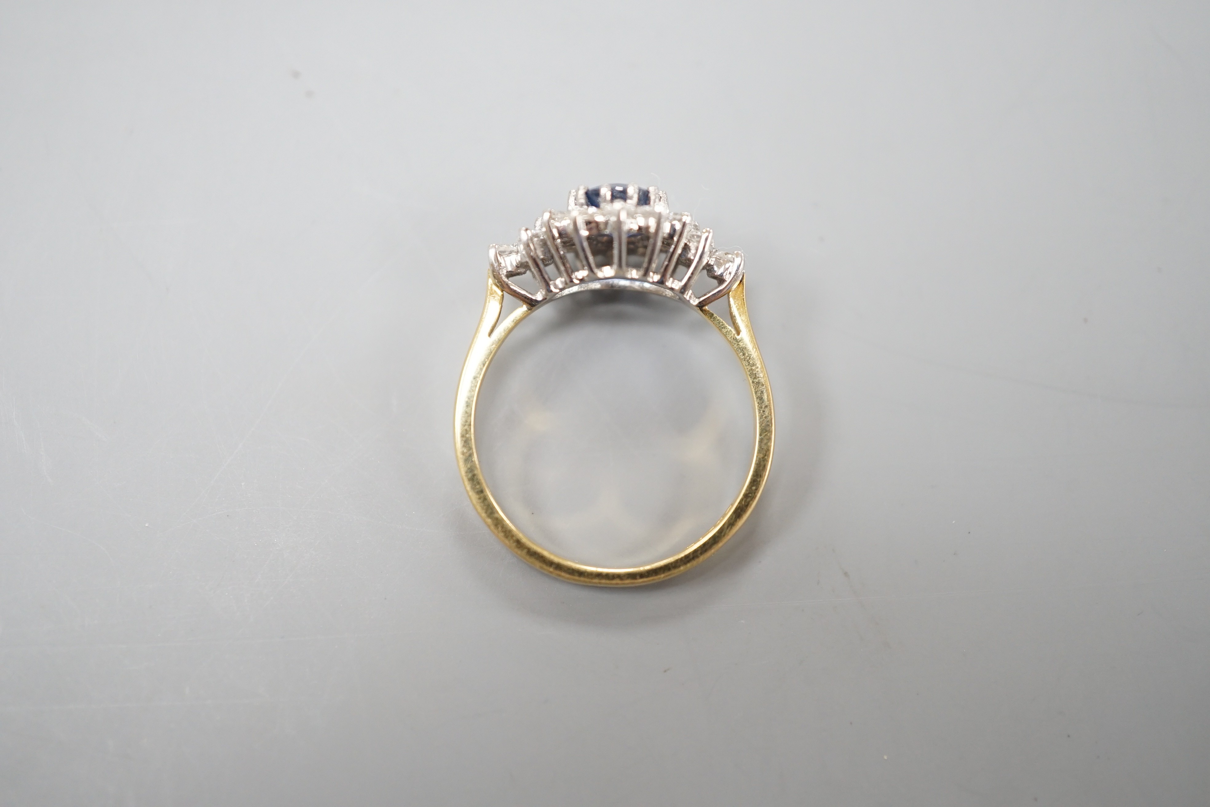A modern 18ct gold, sapphire and diamond set elliptical shaped cluster dress ring, size N, gross - Image 2 of 3