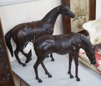 Two finely modelled horses made from brown leather,tallest 49 cms high,