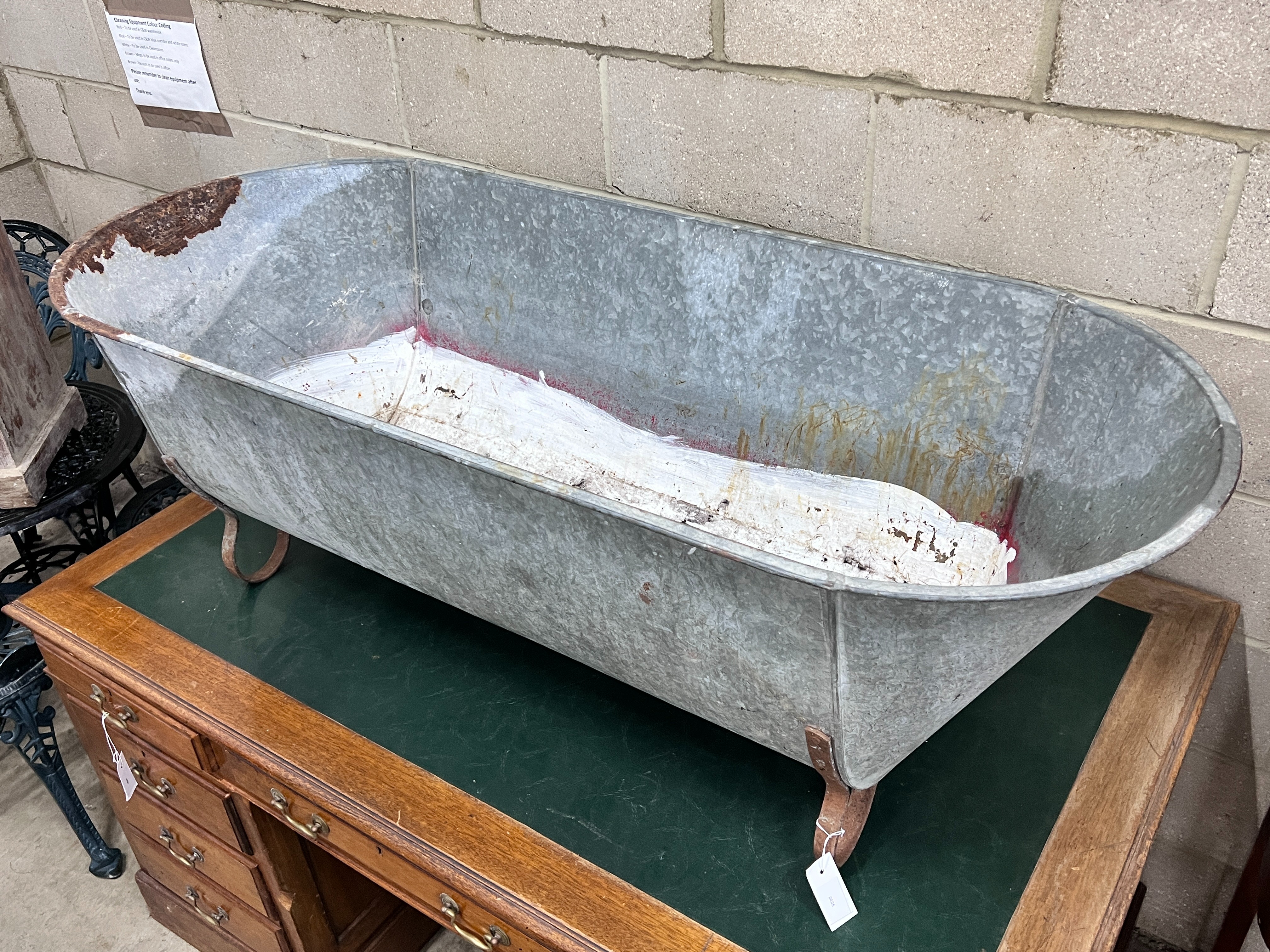 A vintage galvanised trough on wrought iron feet, length 146cm, depth 62cm, height 49cm - Image 2 of 4