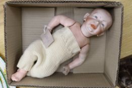 A Kammer & Reinhardt Kaiser Baby doll, mould 100, 36cm, and assorted clothing