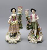 A near pair of Derby candlestick figures,tallest 25.5 cms high,