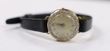 A lady's 18k manual wind wrist watch, with diamond set bezel and dial with baton numerals (a.f.), on