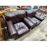 A pair of contemporary studded brown leather armchairs, width 98cm, depth 84cm, height 80cm