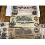 A collection of US Confederate States banknotes, including a confederate states of America $500