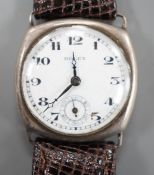 A gentleman's 1920's silver wrist watch, with Arabic dial and subsidiary seconds, the dial signed