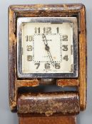 A mid 20th century leather case mounted stainless steel LeCoultre for Cartier travelling watch, with